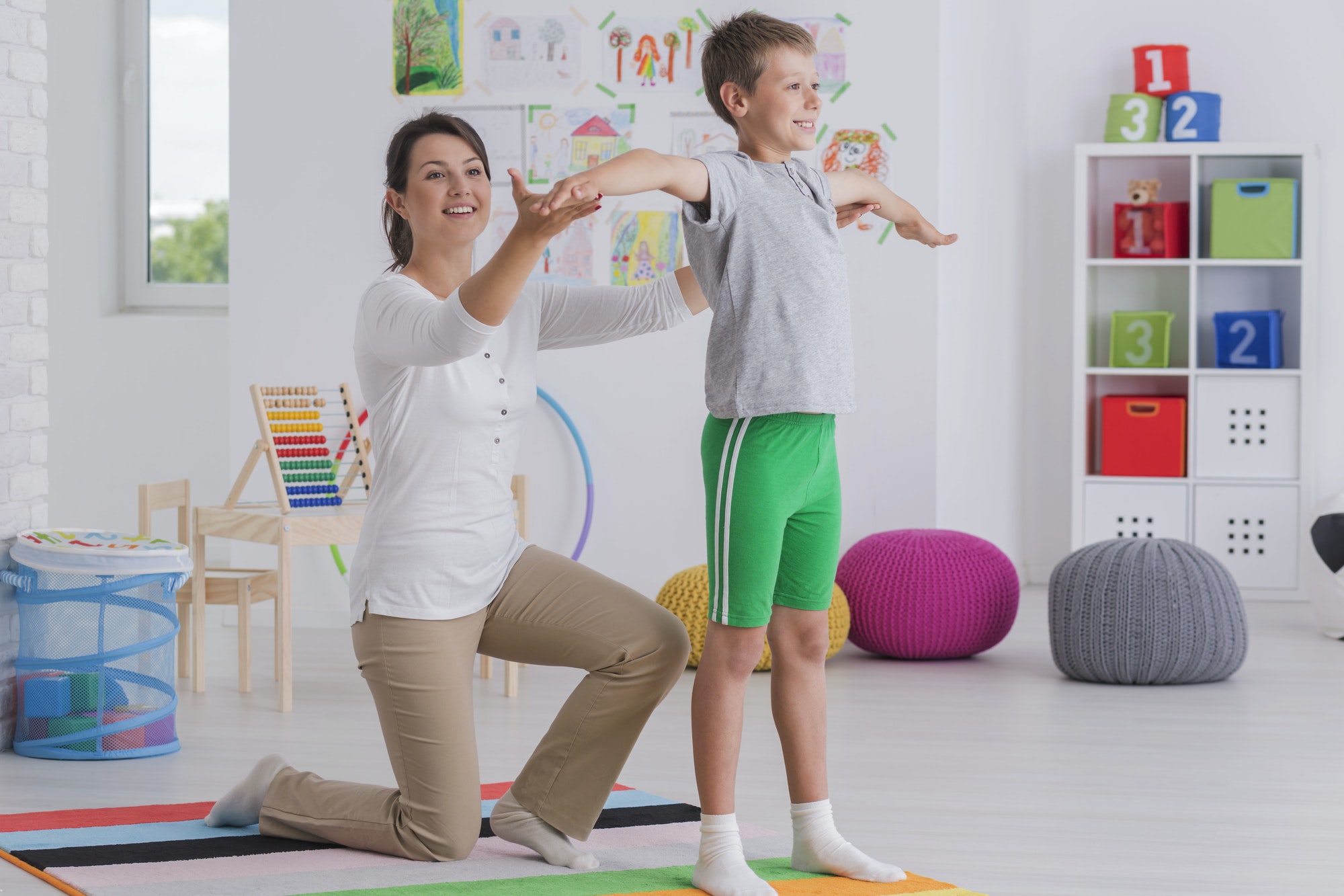 physiotherapist-exercising-with-a-school-boy